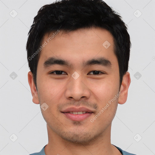 Joyful white young-adult male with short  black hair and brown eyes