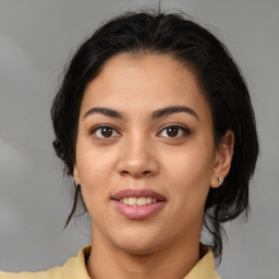 Joyful latino young-adult female with medium  brown hair and brown eyes