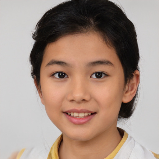 Joyful asian child female with medium  brown hair and brown eyes