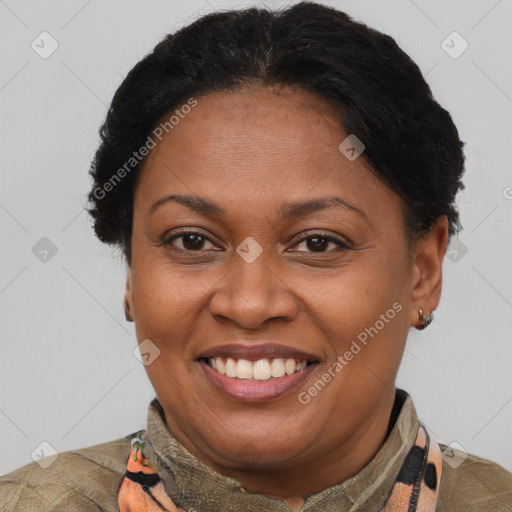 Joyful latino adult female with short  brown hair and brown eyes