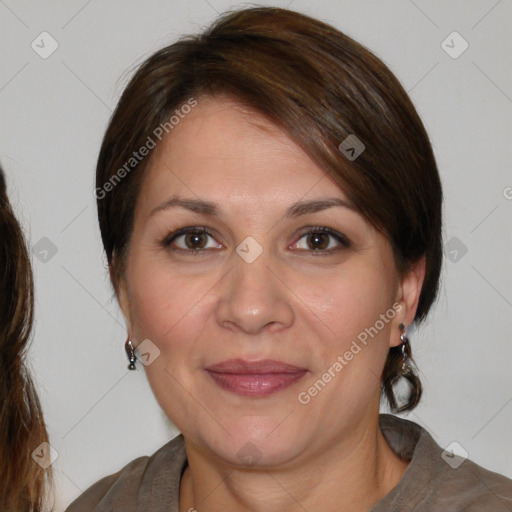 Joyful white adult female with medium  brown hair and brown eyes