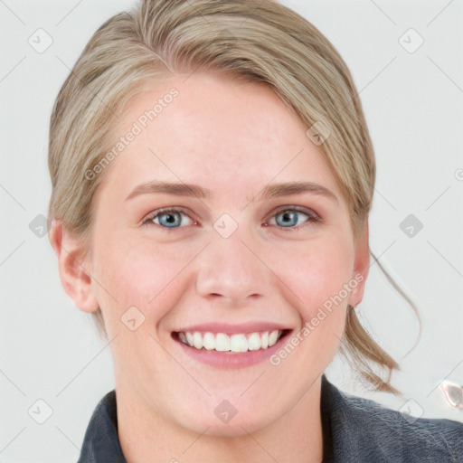 Joyful white young-adult female with medium  brown hair and blue eyes