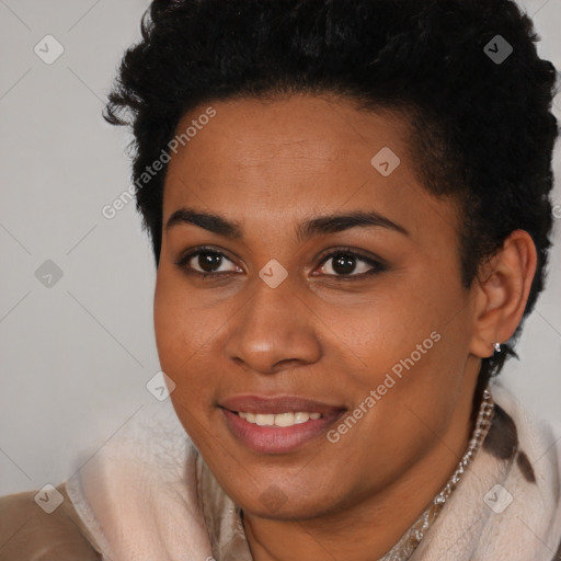 Joyful black young-adult female with short  brown hair and brown eyes