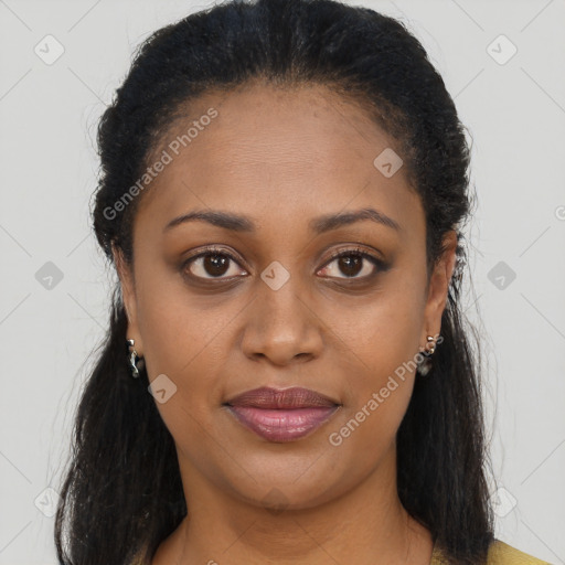 Joyful black young-adult female with long  brown hair and brown eyes