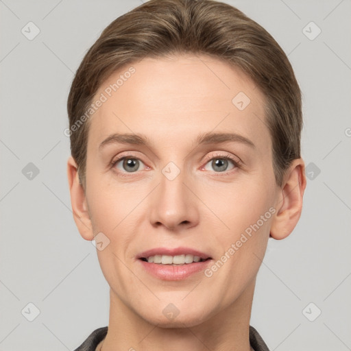 Joyful white young-adult female with short  brown hair and grey eyes