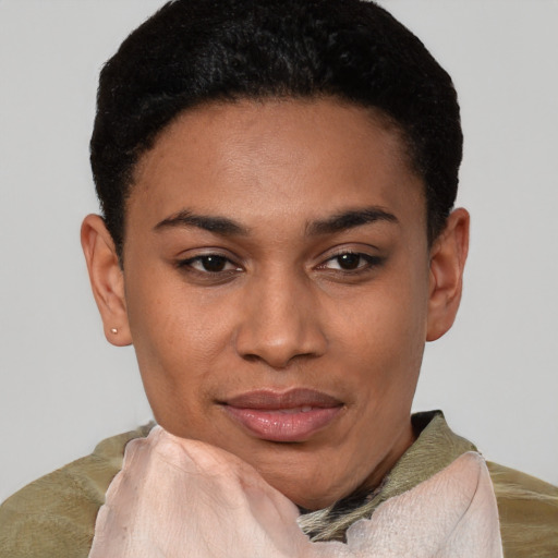 Joyful latino young-adult female with short  black hair and brown eyes