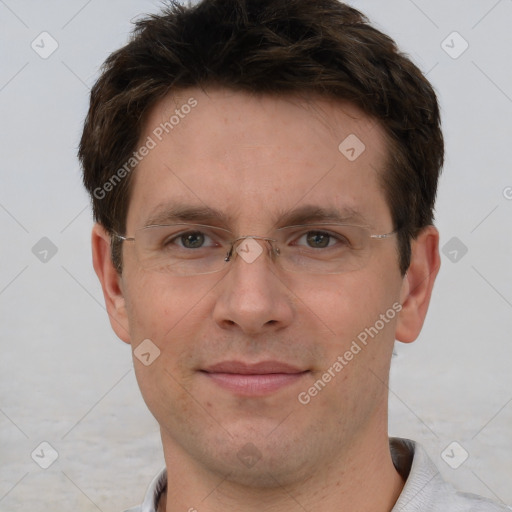 Joyful white adult male with short  brown hair and grey eyes