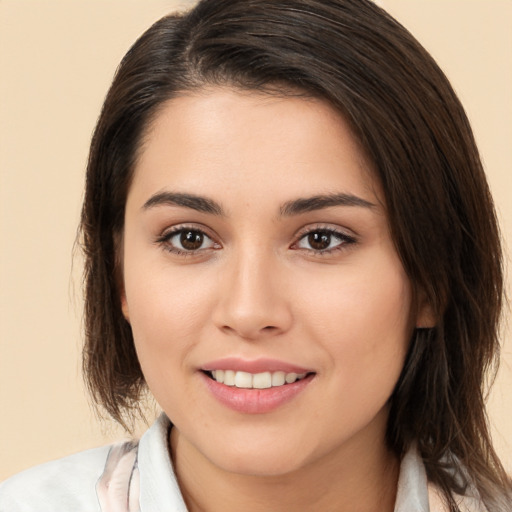 Joyful white young-adult female with medium  brown hair and brown eyes