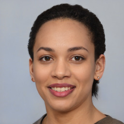 Joyful latino young-adult female with short  brown hair and brown eyes