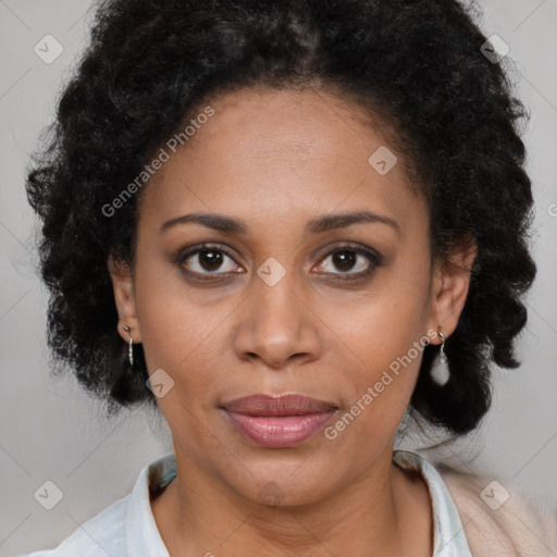 Joyful latino adult female with medium  brown hair and brown eyes