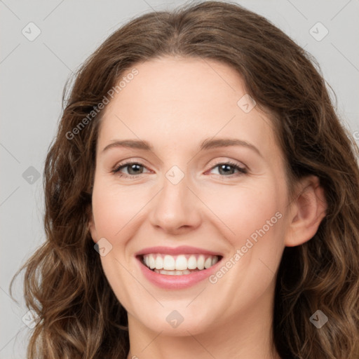 Joyful white young-adult female with long  brown hair and green eyes