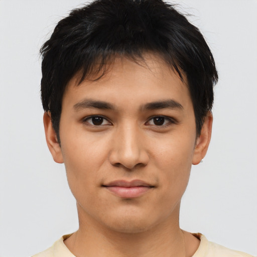 Joyful asian young-adult male with short  black hair and brown eyes