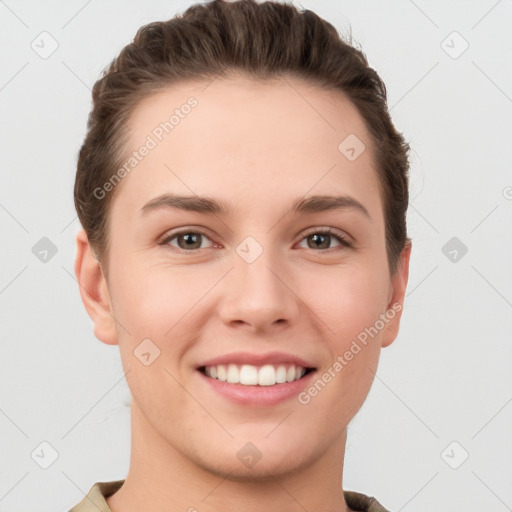 Joyful white young-adult female with short  brown hair and grey eyes