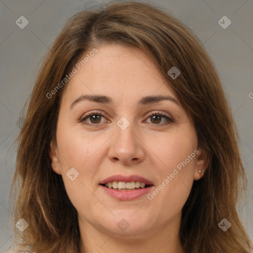 Joyful white adult female with long  brown hair and brown eyes