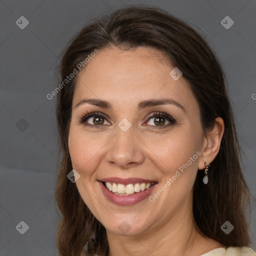 Joyful white adult female with medium  brown hair and brown eyes