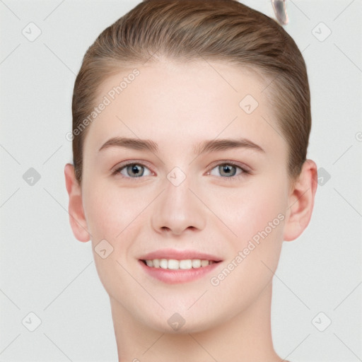 Joyful white young-adult female with short  brown hair and grey eyes