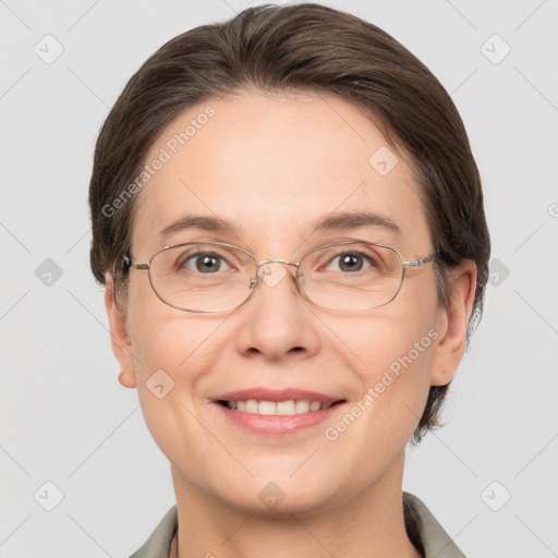 Joyful white adult female with medium  brown hair and grey eyes