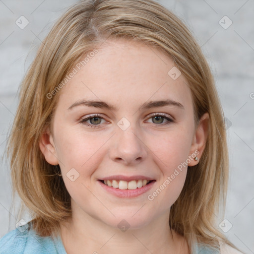 Joyful white young-adult female with medium  brown hair and blue eyes