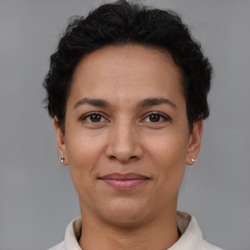 Joyful latino adult female with short  brown hair and brown eyes