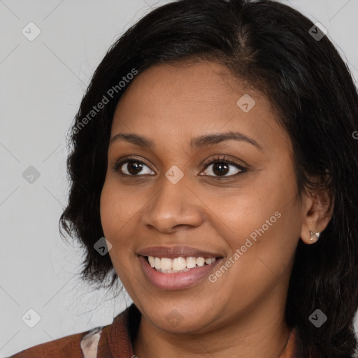 Joyful latino young-adult female with long  brown hair and brown eyes