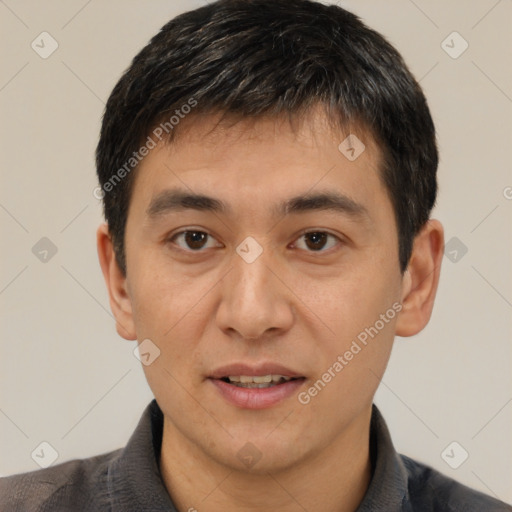 Joyful white young-adult male with short  black hair and brown eyes