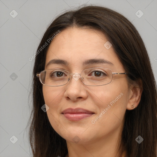 Joyful white adult female with long  brown hair and brown eyes