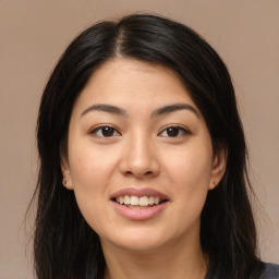 Joyful asian young-adult female with long  brown hair and brown eyes