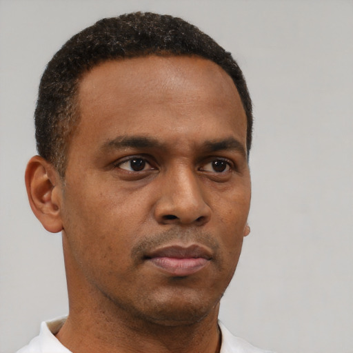 Neutral black young-adult male with short  brown hair and brown eyes