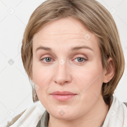 Joyful white young-adult female with medium  brown hair and blue eyes