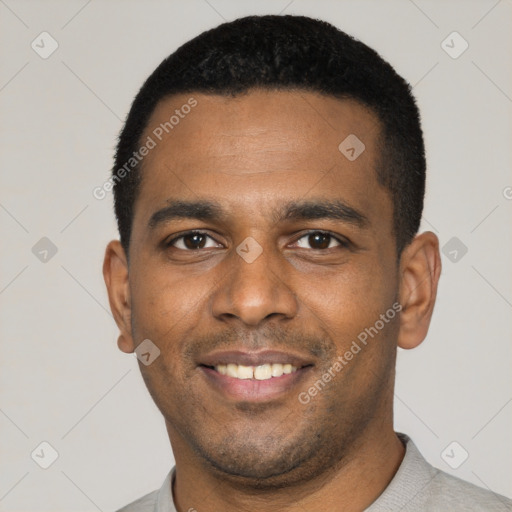 Joyful latino young-adult male with short  black hair and brown eyes