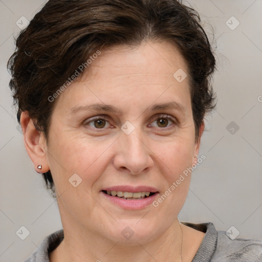 Joyful white adult female with short  brown hair and grey eyes