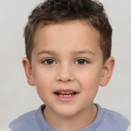 Joyful white child male with short  brown hair and brown eyes