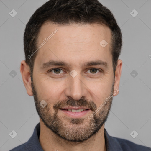 Joyful white adult male with short  black hair and brown eyes