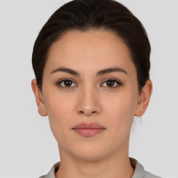 Neutral white young-adult female with short  brown hair and brown eyes