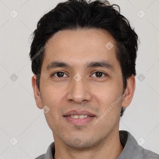 Joyful white young-adult male with short  black hair and brown eyes