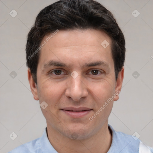 Joyful white adult male with short  brown hair and brown eyes