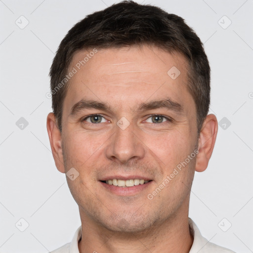 Joyful white young-adult male with short  brown hair and brown eyes