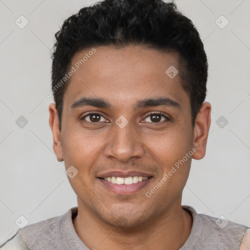 Joyful latino young-adult male with short  black hair and brown eyes