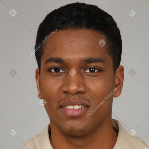 Joyful black young-adult male with short  black hair and brown eyes