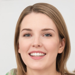 Joyful white young-adult female with long  brown hair and green eyes