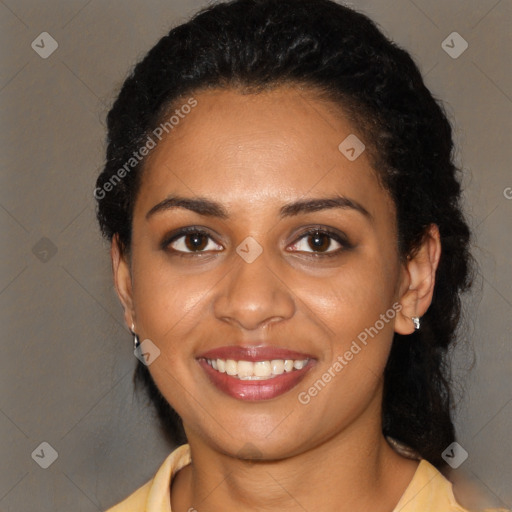 Joyful black young-adult female with medium  black hair and brown eyes