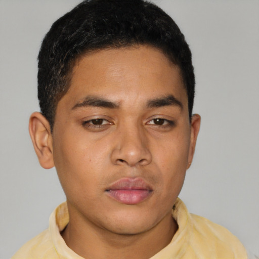 Neutral latino young-adult male with short  brown hair and brown eyes