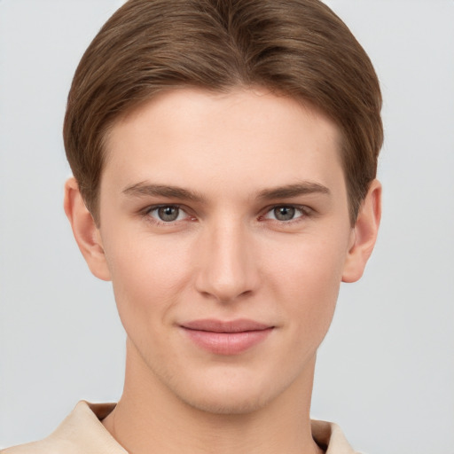 Joyful white young-adult female with short  brown hair and grey eyes