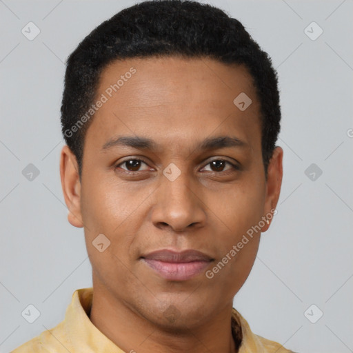 Joyful black young-adult male with short  brown hair and brown eyes