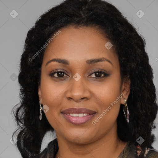 Joyful black young-adult female with long  brown hair and brown eyes