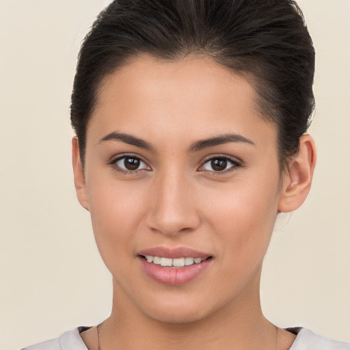 Joyful white young-adult female with short  brown hair and brown eyes