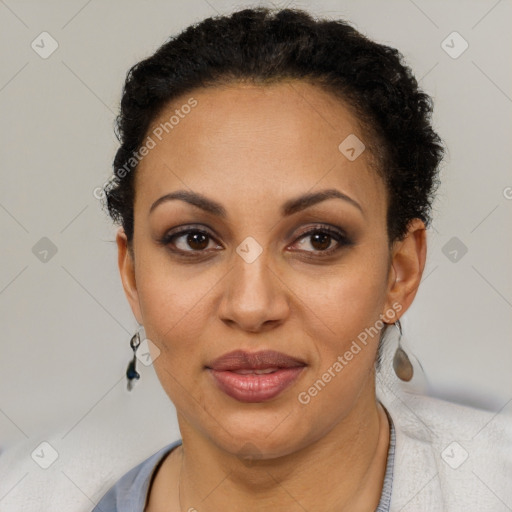 Joyful latino adult female with short  brown hair and brown eyes