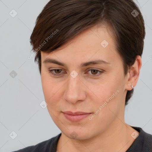 Joyful white young-adult female with short  brown hair and brown eyes