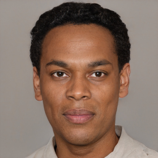 Neutral black young-adult male with short  black hair and brown eyes