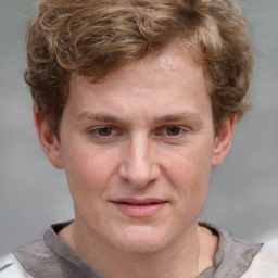 Joyful white adult male with short  brown hair and grey eyes